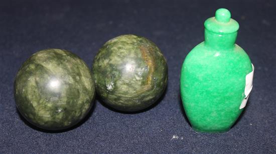 A jade snuff bottle and two balls